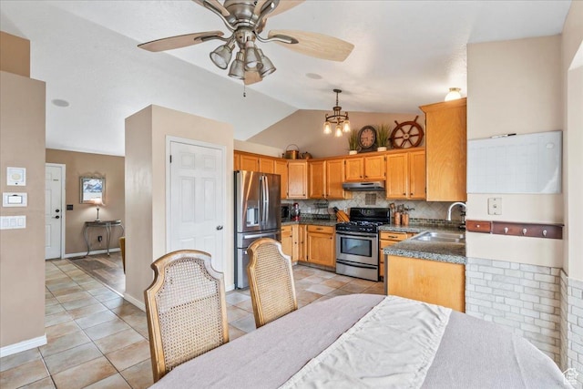 6956 S Firefox Cir, West Jordan, UT 84084 - kitchen featuring stainless steel appliances, under cabinet range hood, dark countertops, ceiling fan, and decorative backsplash