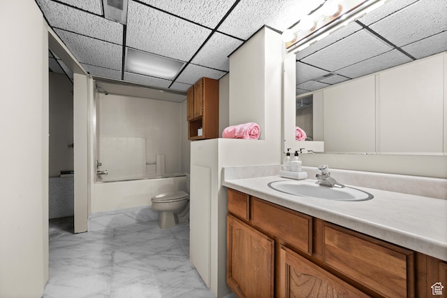 1575 W Alley St, Riverton, UT 84065 - full bathroom with marble look tile flooring, vanity, a paneled ceiling, and tub / shower combination