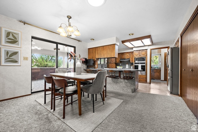 1575 W Alley St, Riverton, UT 84065 - dining area with plenty of natural light, light carpet, and a chandelier