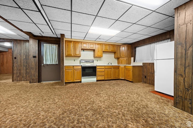 1575 W Alley St, Riverton, UT 84065 - kitchen featuring white appliances, wood walls, carpet, brown cabinets, and a paneled ceiling