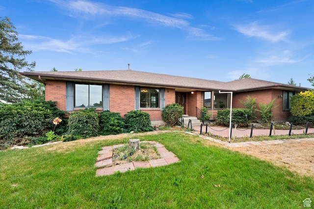 1575 W Alley St, Riverton, UT 84065 - single story home with brick siding, a front yard, and a patio area