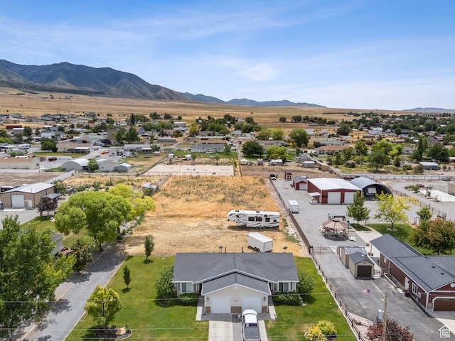 1884 E Shepard Ln, Lake Point, UT 84074 - aerial perspective of suburban area featuring a mountainous background