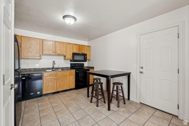1884 E Shepard Ln, Lake Point, UT 84074 - kitchen with black appliances, dark countertops, and light tile patterned floors