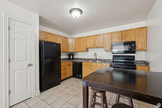 1884 E Shepard Ln, Lake Point, UT 84074 - kitchen featuring black appliances, dark countertops, and light tile patterned floors