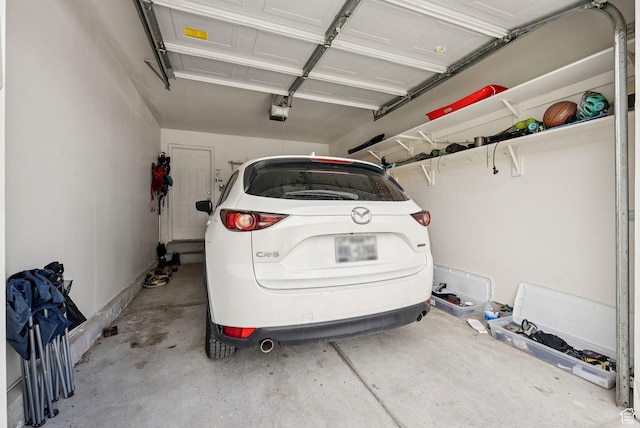 1884 E Shepard Ln, Lake Point, UT 84074 - garage featuring a garage door opener