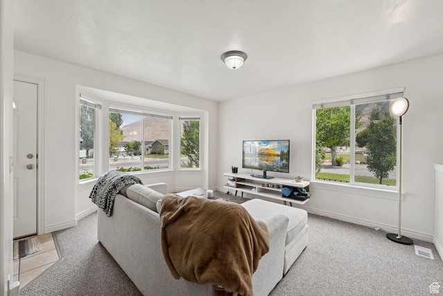 1884 E Shepard Ln, Lake Point, UT 84074 - living room with healthy amount of natural light and light carpet