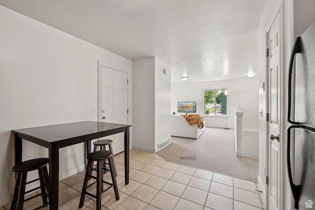 1884 E Shepard Ln, Lake Point, UT 84074 - dining room with light colored carpet and light tile patterned floors