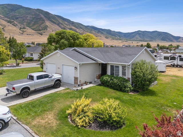 1884 E Shepard Ln, Lake Point, UT 84074 - ranch-style house featuring an attached garage, a mountain view, a front yard, and driveway