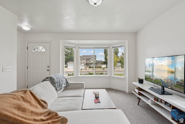 1884 E Shepard Ln, Lake Point, UT 84074 - carpeted living room featuring healthy amount of natural light