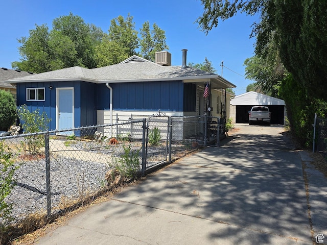 1134 W Illinois Ave S, Salt Lake City, UT 84104 - view of front of home with a shingled roof, board and batten siding, and concrete driveway