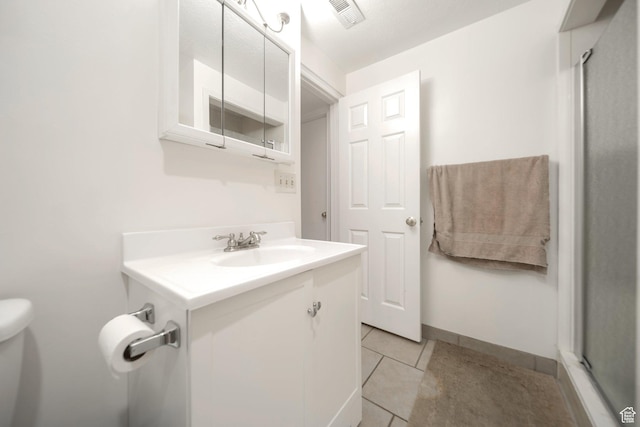 527 Applewood Dr, Bountiful, UT 84010 - bathroom with vanity, tile patterned floors, and a shower with shower door