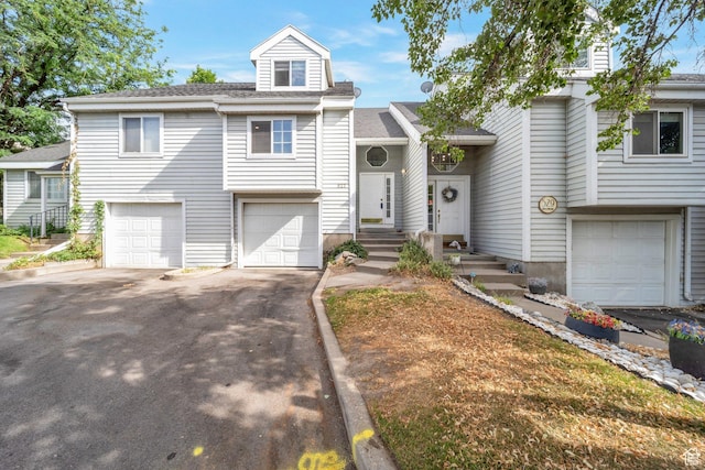 527 Applewood Dr, Bountiful, UT 84010 - view of front of home featuring an attached garage and asphalt driveway