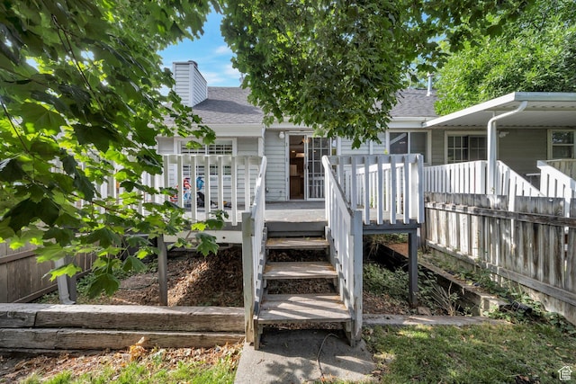 527 Applewood Dr, Bountiful, UT 84010 - entrance to property with a shingled roof, a chimney, and a wooden deck