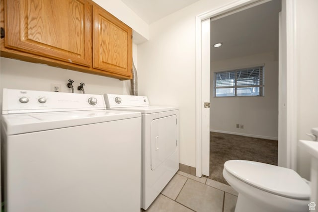 527 Applewood Dr, Bountiful, UT 84010 - laundry area with washing machine and dryer, light colored carpet, light tile patterned floors, and cabinet space