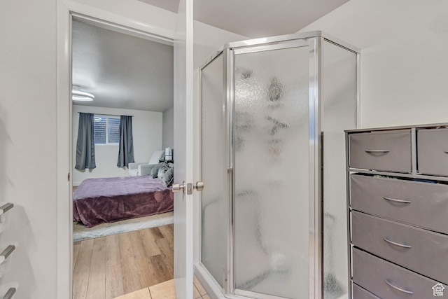 5235 S Glendon St Unit W3, Murray, UT 84123 - ensuite bathroom featuring a shower stall and wood finished floors