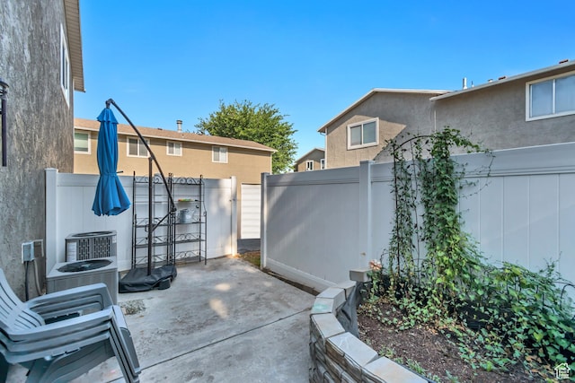 5235 S Glendon St Unit W3, Murray, UT 84123 - fenced backyard featuring a patio