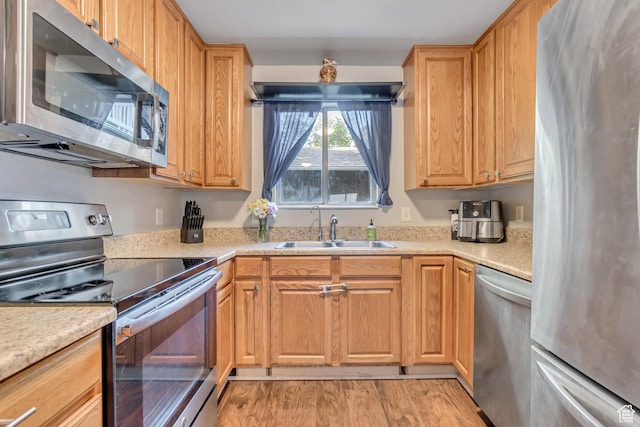 5235 S Glendon St Unit W3, Murray, UT 84123 - kitchen with appliances with stainless steel finishes, light countertops, and light wood finished floors