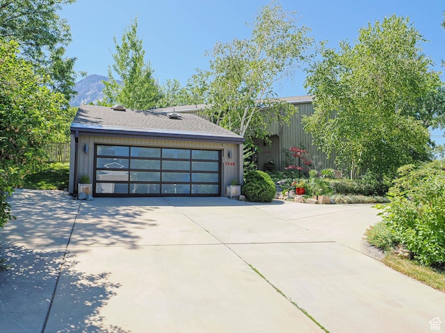 3348 E Splendor Cir, Holladay, UT 84124 - mid-century modern home with a detached garage and a mountain view