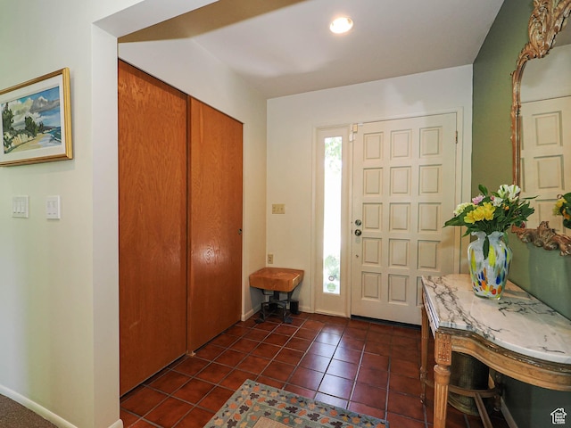 3348 E Splendor Cir, Holladay, UT 84124 - foyer featuring dark tile patterned flooring and baseboards