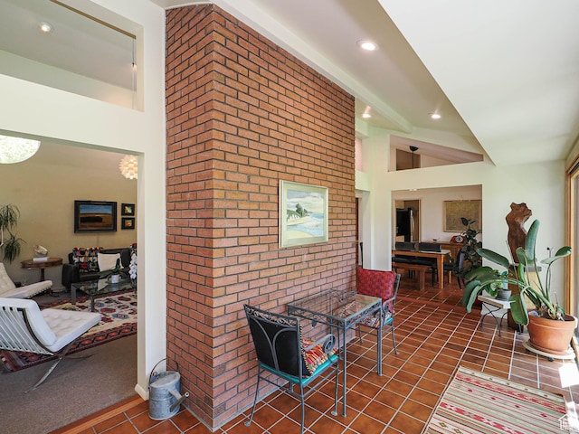 3348 E Splendor Cir, Holladay, UT 84124 - hall with tile patterned floors, brick wall, and recessed lighting