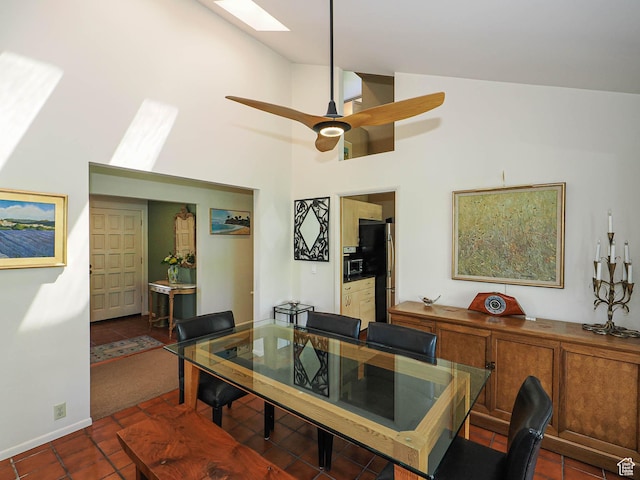 3348 E Splendor Cir, Holladay, UT 84124 - tiled dining space featuring a skylight, high vaulted ceiling, and a ceiling fan