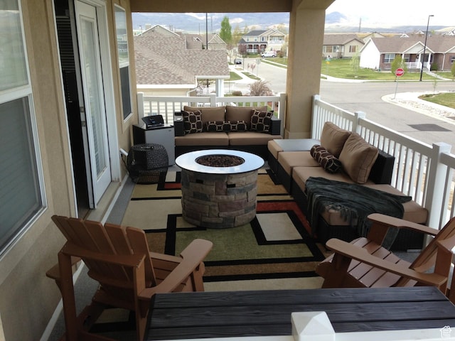 5453 W Mayflower St, West Jordan, UT 84081 - balcony with a residential view and an outdoor living space with a fire pit