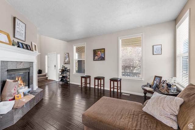 5453 W Mayflower St, West Jordan, UT 84081 - living area with a tiled fireplace and wood finished floors