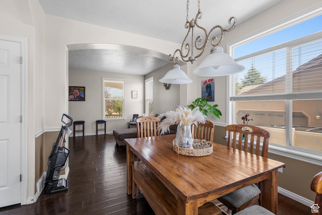 5453 W Mayflower St, West Jordan, UT 84081 - dining space with arched walkways and hardwood / wood-style floors