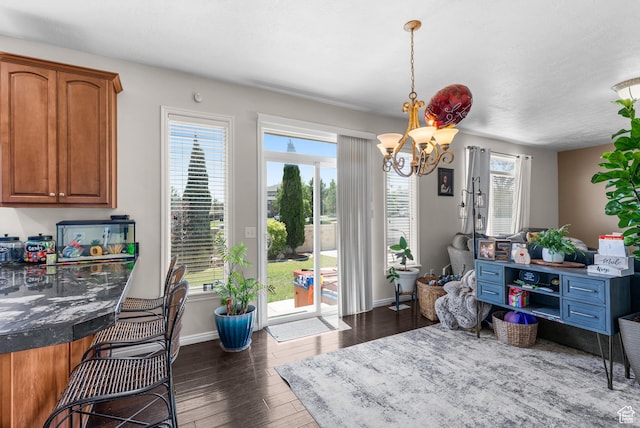 5453 W Mayflower St, West Jordan, UT 84081 - dining space with dark wood-style floors and a chandelier