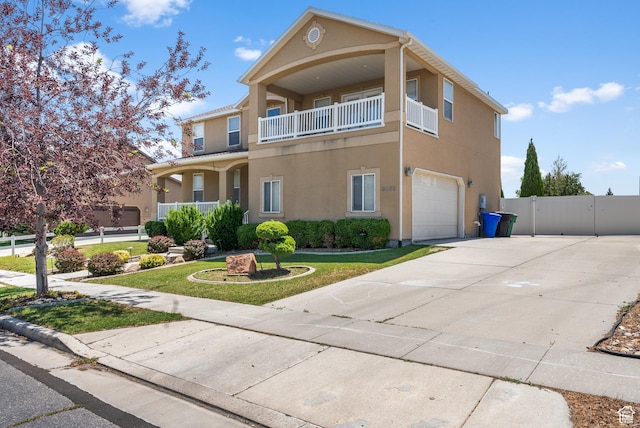 5453 W Mayflower St, West Jordan, UT 84081 - view of front of property featuring a garage, stucco siding, driveway, and a gate