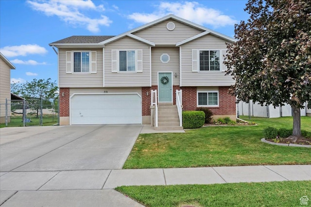 771 N 1725 W, Clinton, UT 84015 - raised ranch featuring an attached garage, brick siding, and driveway