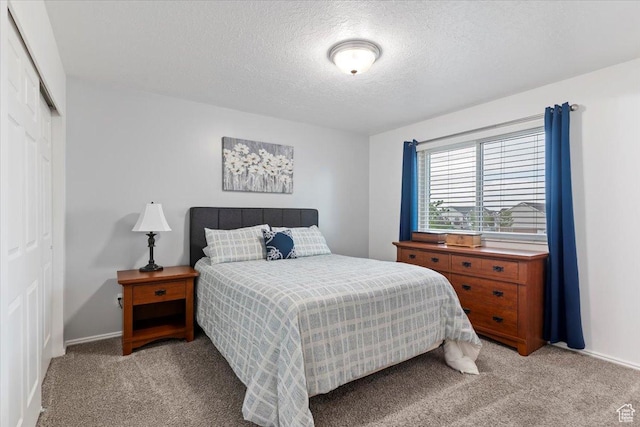 771 N 1725 W, Clinton, UT 84015 - bedroom with light colored carpet, a closet, and a textured ceiling