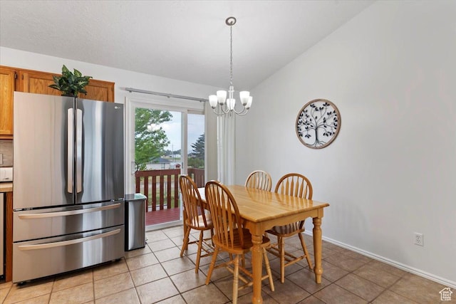 771 N 1725 W, Clinton, UT 84015 - dining space featuring a chandelier, vaulted ceiling, and light tile patterned flooring