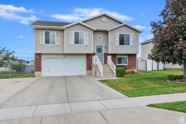 771 N 1725 W, Clinton, UT 84015 - raised ranch with a garage, driveway, and brick siding