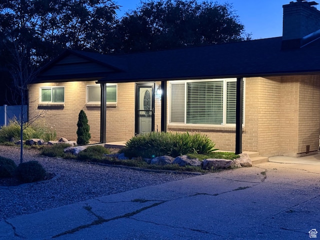 174 W Dawson St, Layton, UT 84041 - view of front facade with brick siding and a chimney