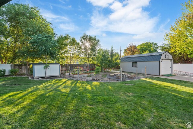 174 W Dawson St, Layton, UT 84041 - fenced backyard with a garden and a storage unit