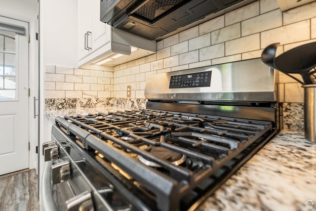 174 W Dawson St, Layton, UT 84041 - kitchen view of appliances with stainless steel finishes, backsplash, white cabinets, and light stone countertops