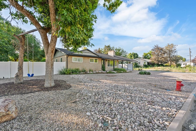 174 W Dawson St, Layton, UT 84041 - single story home featuring a chimney, brick siding, and driveway
