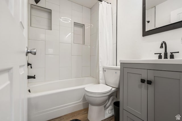 174 W Dawson St, Layton, UT 84041 - bathroom featuring wood finished floors, vanity, and shower / bath combo with shower curtain