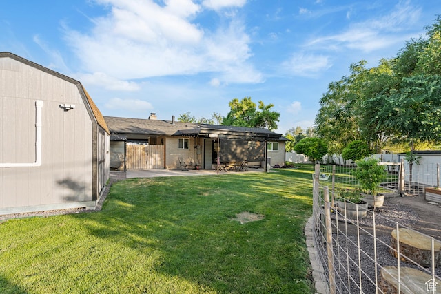 174 W Dawson St, Layton, UT 84041 - view of yard with a vegetable garden and a patio area