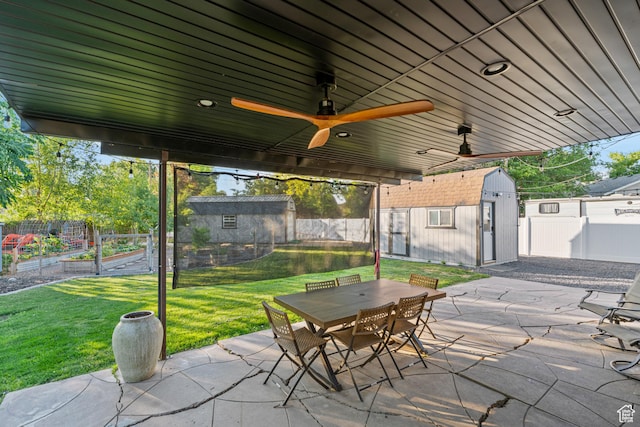 174 W Dawson St, Layton, UT 84041 - fenced backyard featuring a patio area, a garden, a storage unit, and outdoor dining area