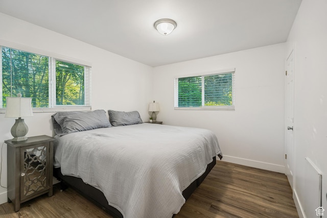 174 W Dawson St, Layton, UT 84041 - bedroom featuring wood finished floors and baseboards