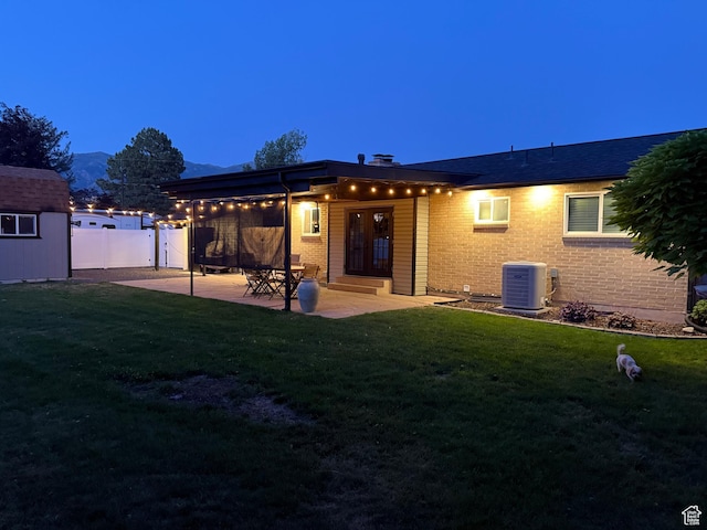 174 W Dawson St, Layton, UT 84041 - back of property with a patio area and brick siding