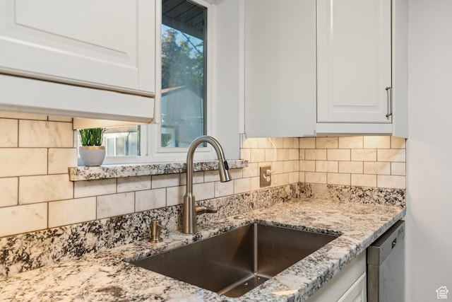 174 W Dawson St, Layton, UT 84041 - kitchen with dishwasher, light stone countertops, decorative backsplash, and white cabinetry