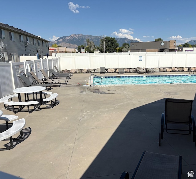 2896 W 3965 S Unit 86, West Haven, UT 84401 - community pool with a mountain view, a fenced backyard, and a patio