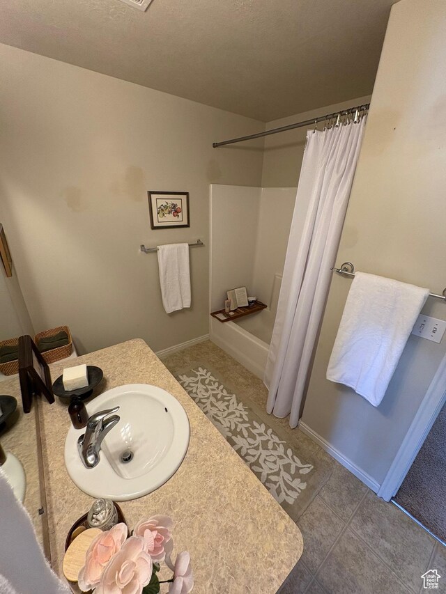 2896 W 3965 S Unit 86, West Haven, UT 84401 - bathroom with vanity, tile patterned flooring, and shower / bath combo with shower curtain
