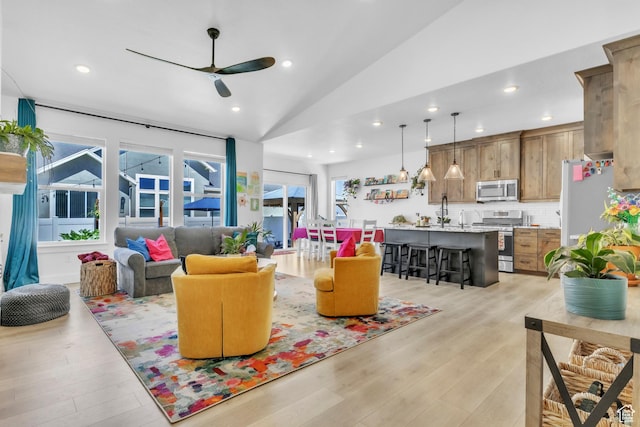 2456 W Maple St, Mapleton, UT 84664 - living room featuring a ceiling fan, light wood finished floors, vaulted ceiling, and recessed lighting