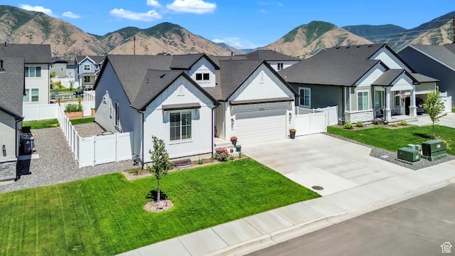 2456 W Maple St, Mapleton, UT 84664 - view of front of home with concrete driveway, a residential view, a mountain view, and board and batten siding