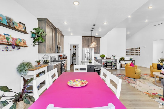 2456 W Maple St, Mapleton, UT 84664 - dining area with light wood-style flooring and recessed lighting