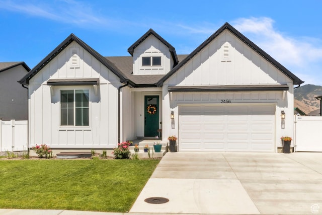 2456 W Maple St, Mapleton, UT 84664 - modern farmhouse style home featuring board and batten siding, a garage, driveway, and a shingled roof